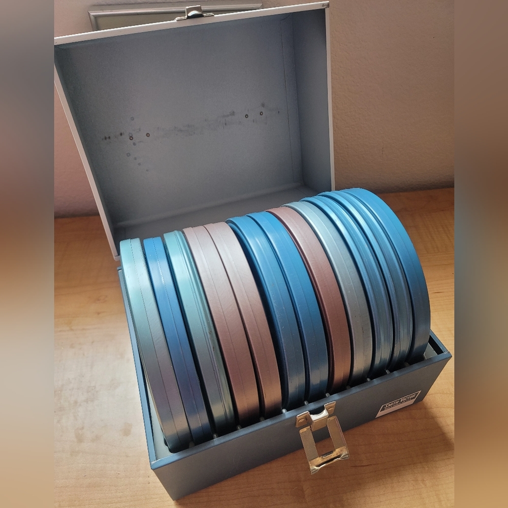 Set of 12, 6 inch reel to reel with cans and storage box.